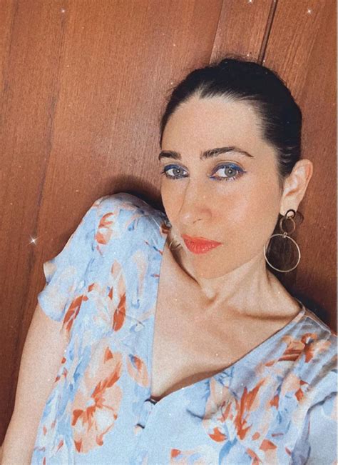 Karisma Kapoor shows off her makeup skills in a blue floral blouse with ...