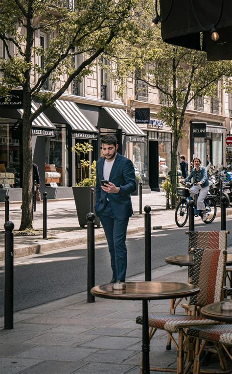 Man Sitting on Chairs and Reading · Free Stock Photo