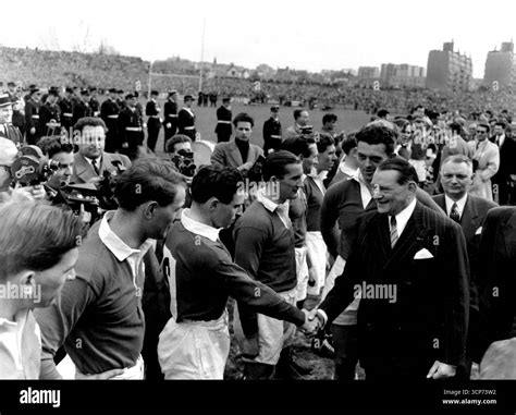 M. Coty, French President, meets the Welsh team before the game. Seen ...