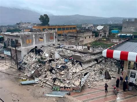 7-Year-Old Girl Protects Brother Under Rubble In A Heartbreaking Photograph
