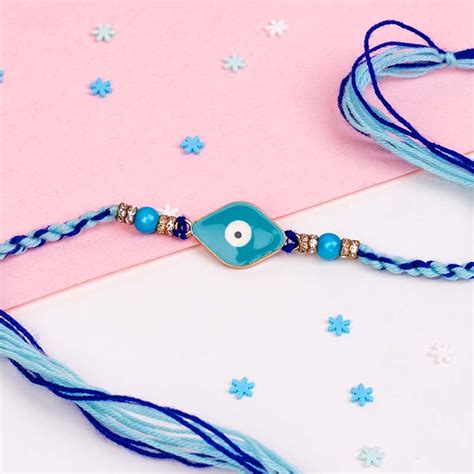 Send Evil Eye Rakhi with Haldiram Raj Bhog Sweet Online - RKH23-110846 ...