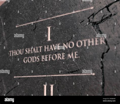 A view of the first commandment etched into a cracked stone tablet on ...
