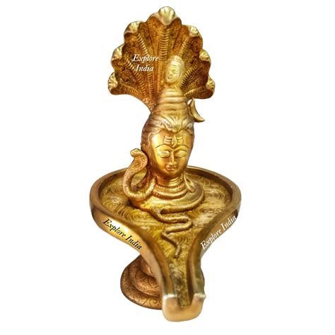 Buy Brass Shivling with Face and Sheshnaag on Head Statue Showpiece ...