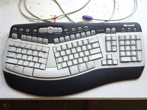 Image result for Microsoft Wireless Natural Multimedia Keyboard Receiver