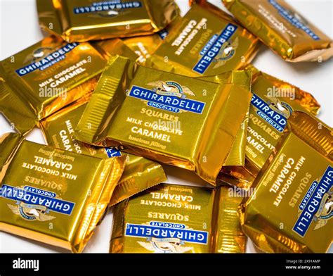 A pile of Ghirardelli Milk Chocolate Caramel Squares Stock Photo - Alamy