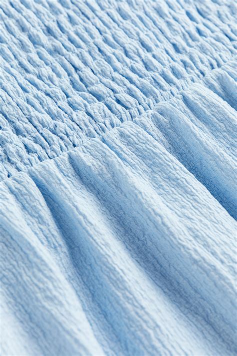 Smocked jersey dress - Light blue - Kids | H&M IN