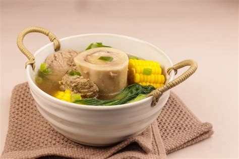 Beef bulalo is a filipino beef shank soup in clear broth | Premium Photo