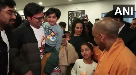 Yogi in Japan: Indian diaspora members greet UP CM wearing bulldozer T ...
