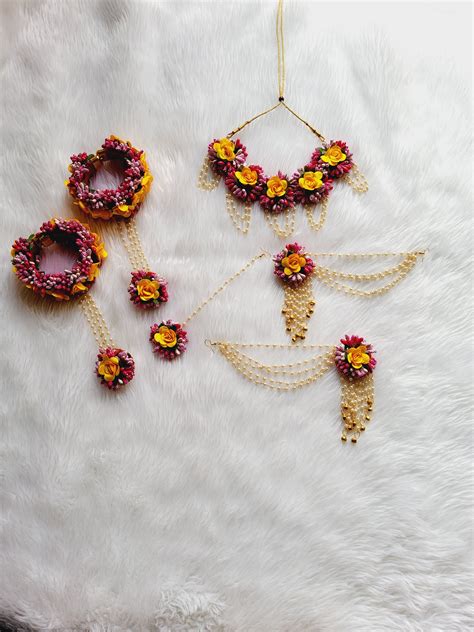 Stunning flower jewellery for Haldi in yellow and rani pink color ...