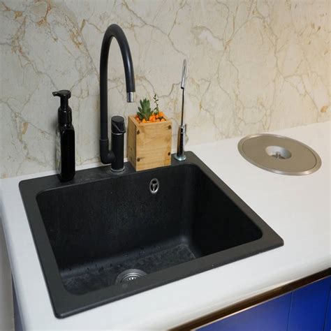 Kitchen sink with countertop waster bin | homify