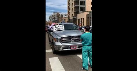 Video: Nurse blocks anti-lockdown protest in Denver, US