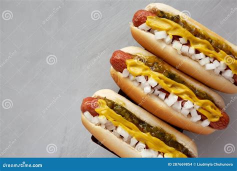 Homemade Deep Fried Hot Dogs with Mustard, Onion and Pickle Relish on a ...