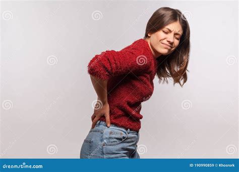 Unhealthy Girl in Shaggy Sweater Touching Sore Back, Feeling Acute Pain, Suffering Kidney ...