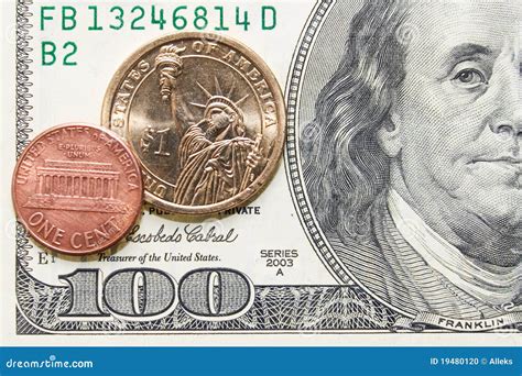 One Cent And Dollar Coins On One Hundred Bill Stock Photo - Image: 19480120