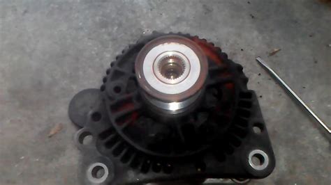 how to change alternator pulley on nissan navara