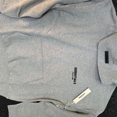 Grey Essentials hoodie - Depop