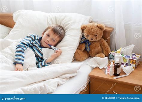 Sick Child Boy Lying in Bed with a Fever, Resting Stock Image - Image ...