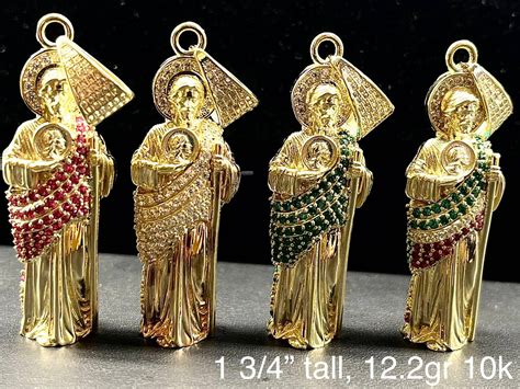Download San Judas Tadeo Gold Pendant Wallpaper | Wallpapers.com