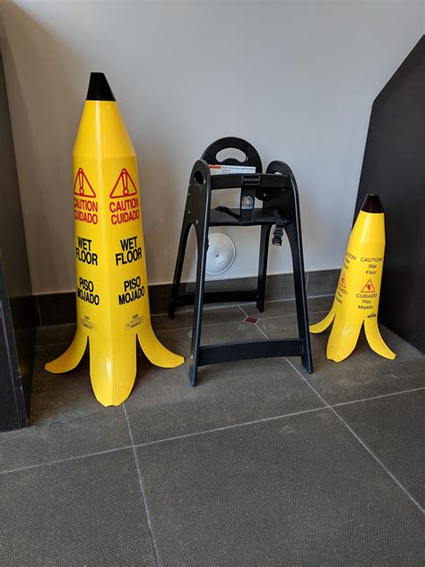 These wet floor signs look like banana peels. Smaller sign for ...