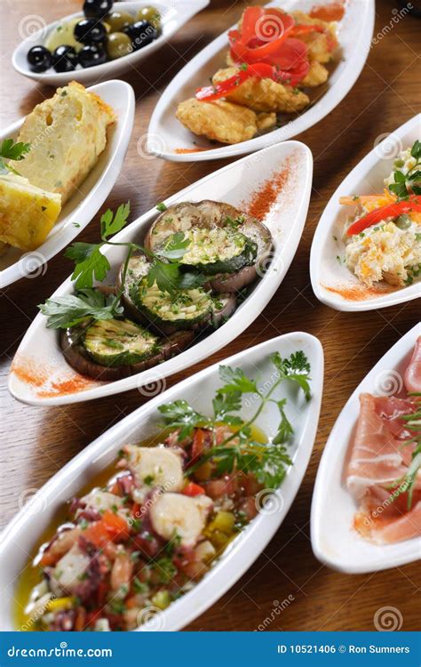 Plates of Spanish tapas stock photo. Image of zucchini - 10521406