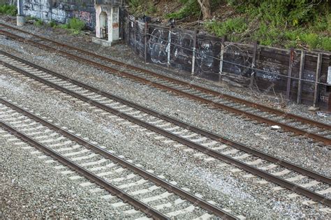 Premium Photo | Railroad tracks and a train represent journey ...