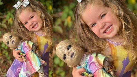 Bizarre-Looking Doll: This beautiful girl plays with the devilish doll ...