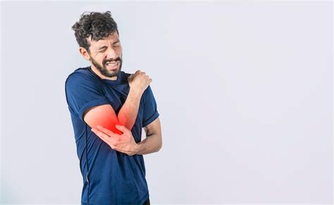 Concept of a man with rheumatism elbow pain man massaging sore elbow ...