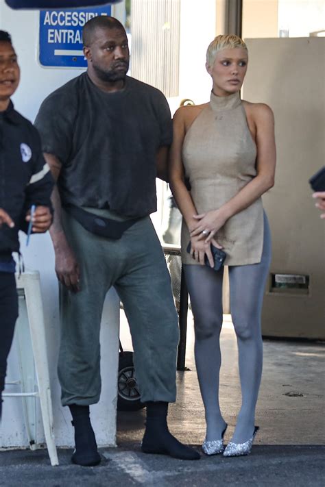 Kanye West squeezes wife Bianca Censori's butt and buries his head in her boobs in rare PDA ...