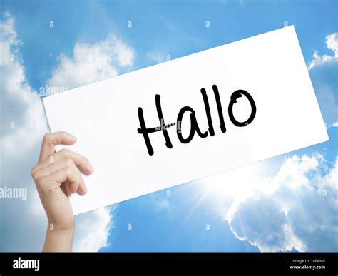 Hallo (Hello in German) Sign on white paper. Man Hand Holding Paper ...