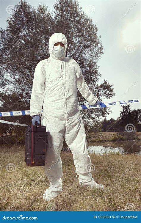 Technician Criminologist Photographing Tire Print Left In Dust Of Field ...
