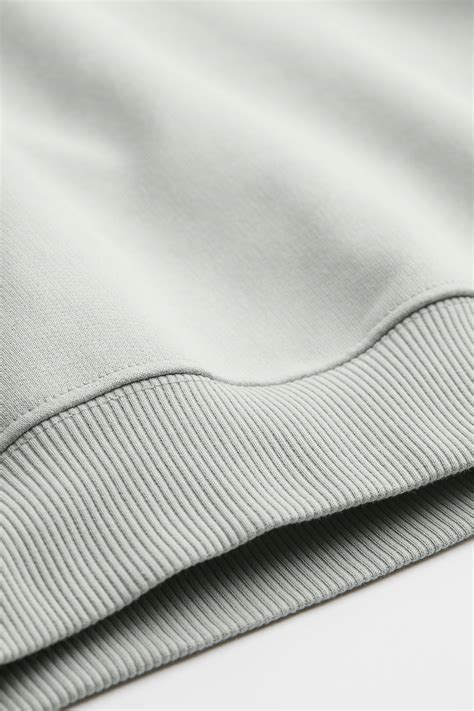 Cotton hoodie - Pale sage green - Men | H&M IN