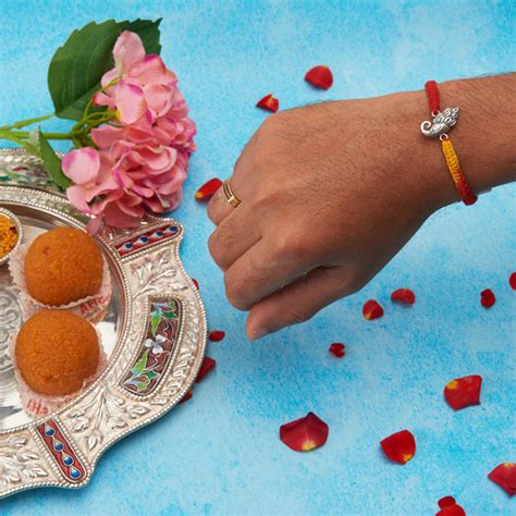 Lord Ganesha Mauli thread Rakhi – Abaran Timeless Jewellery Pvt.Ltd