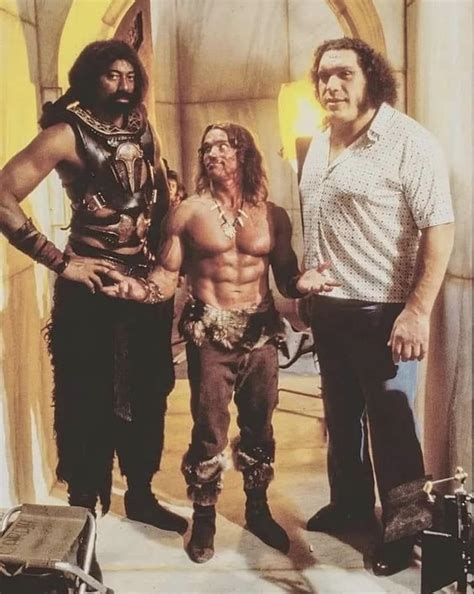 Arnold Schwarzenegger standing in between Wilt Chamberlain and André ...