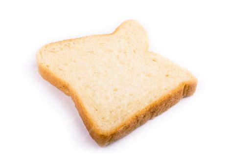 Premium Photo | A piece of bread isolate a slice of white bread ...