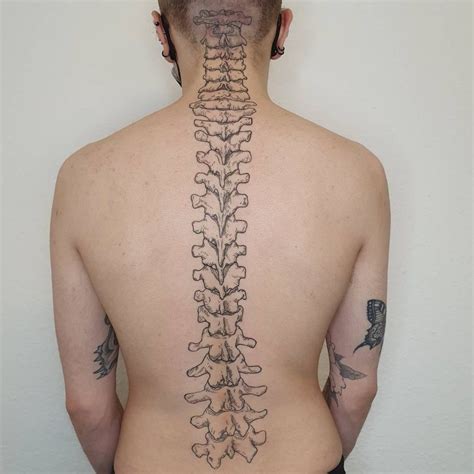 777 spine tattoo simple male