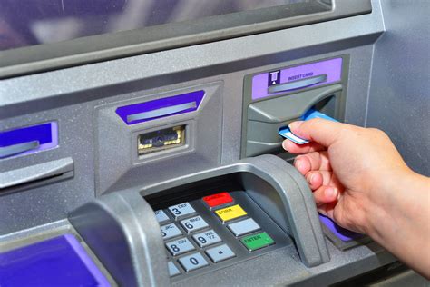 Woman`s Hand Inserting Debit Card into an ATM Stock Image - Image of ...