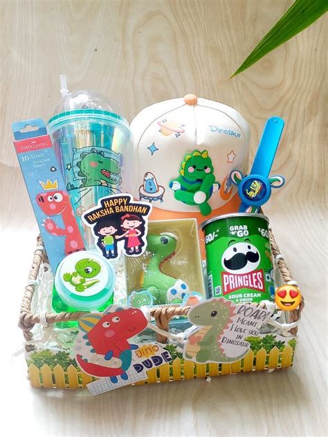 Dinosaur Rakhi Hamper for Kids – Dino Cap, Sipper, Pringles, Stationer ...