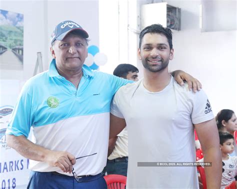 Capt Ravi Dey poses with Biren Dey during an inter-club swimming ...