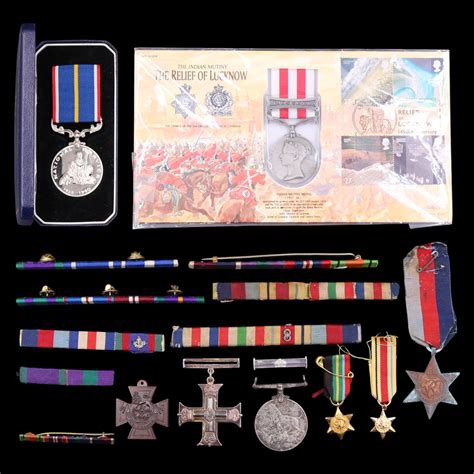 A cased National Service Medal together with ribbon bars, etc