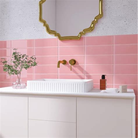 Modern Bathroom with Pink Subway Tiles and Gold Mirror Accents