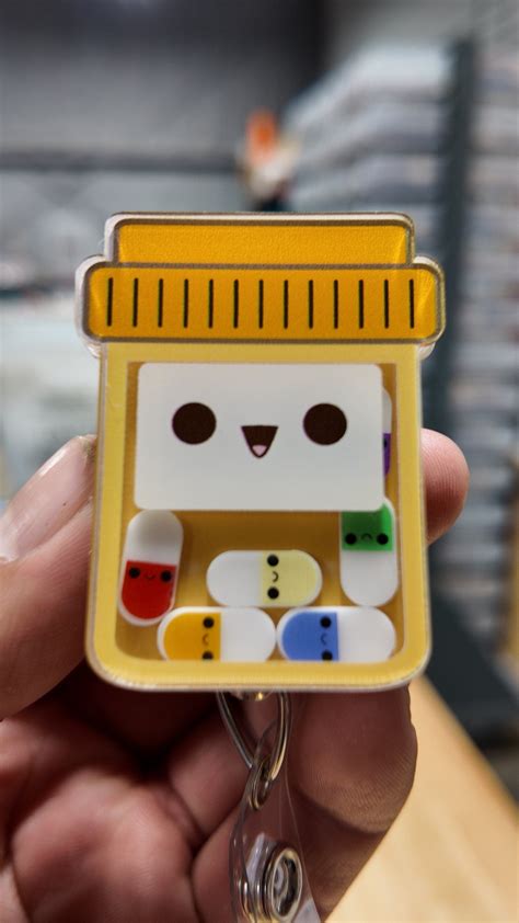 Cute pill bottle shaker badge reel, that’s on back order , pharmacist ...