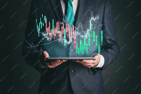 A robotic hand engaged with a laptop, illustrating stock market trends through data visualizations