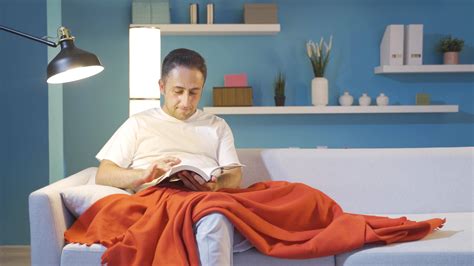 Man reading a book while lying down. 42542766 Stock Video at Vecteezy
