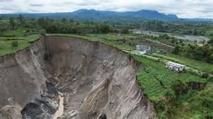 Massive three-hectare-wide sinkhole swallows farmland in Indonesia ...
