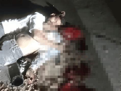 Youth falls asleep embracing friend's bloodied body on road
