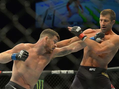 Download English Ufc Fighter Michael Bisping Strikes Luke Rockhold 2016 Photograph Wallpaper ...