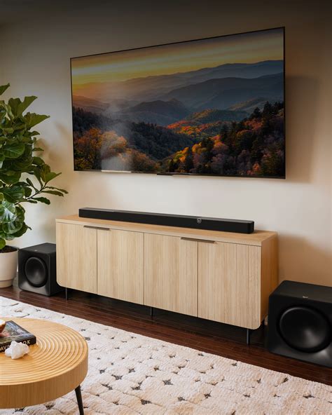 https://klipsch.imgix.net/general/Flexus-CORE-300-and-SUB-200-in-condo-with-landscape-on-tv2_2000x2500.png?crop=focalpoint&domain=klipsch.imgix.net&fit=crop&fm=webp&fp-x=0.5&fp-y=0.5&h=1750&ixlib=php-3.3.1&q=100&w=1400