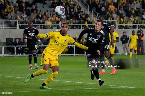 Mohamed Farsi of the Columbus Crew and Pedro Santos of D.C. United ...