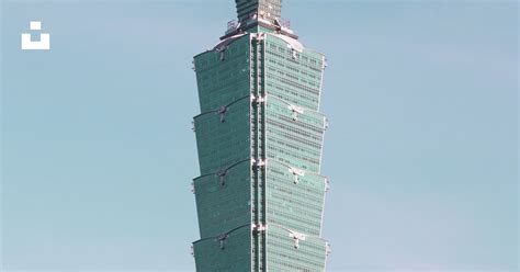 Photo of Taipei 101 tower against a blue sky.