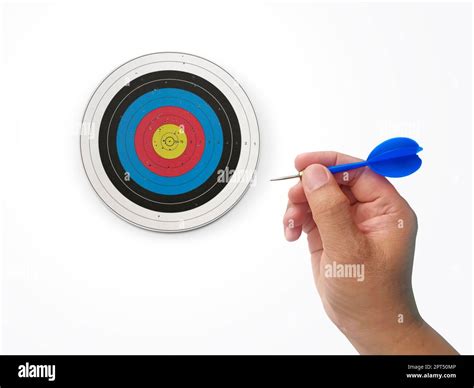 Human hand is throwing the darts target to the darts board. a man's ...